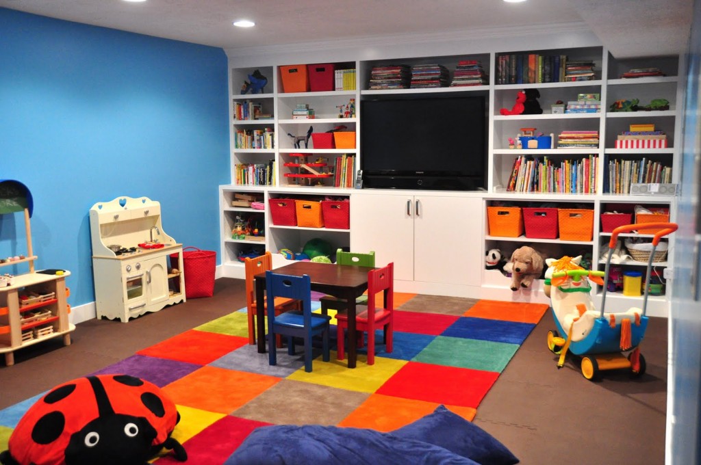 A kids basement playroom is safe and a great place to contain the clutter.